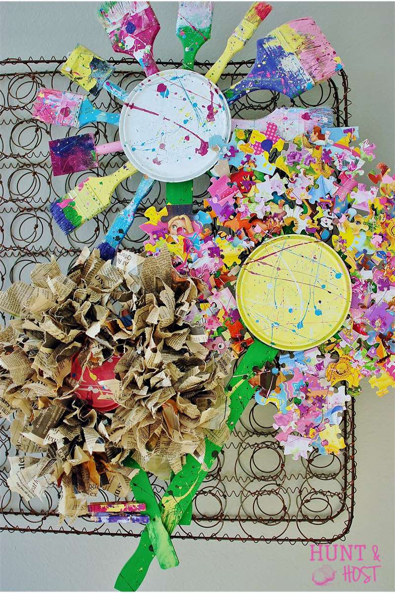 paint brushes, newspaper and puzzle pieces flowers
