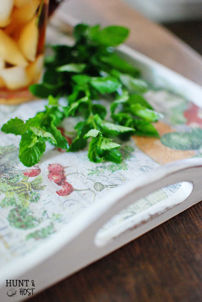 This boring tray gets a farmhouse garden makeover. A DIY napkin "painting" tutorial. www.huntandhost.net
