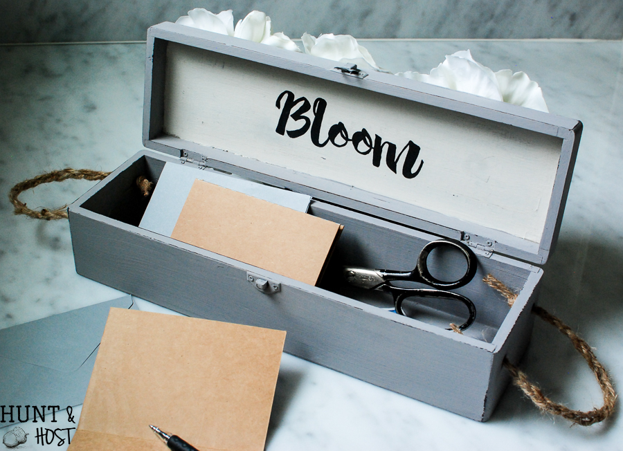 An old wine gift box transformed into a blooming storage box with dollar store flowers. PLUS five other DIY dollar store ideas with flowers. 