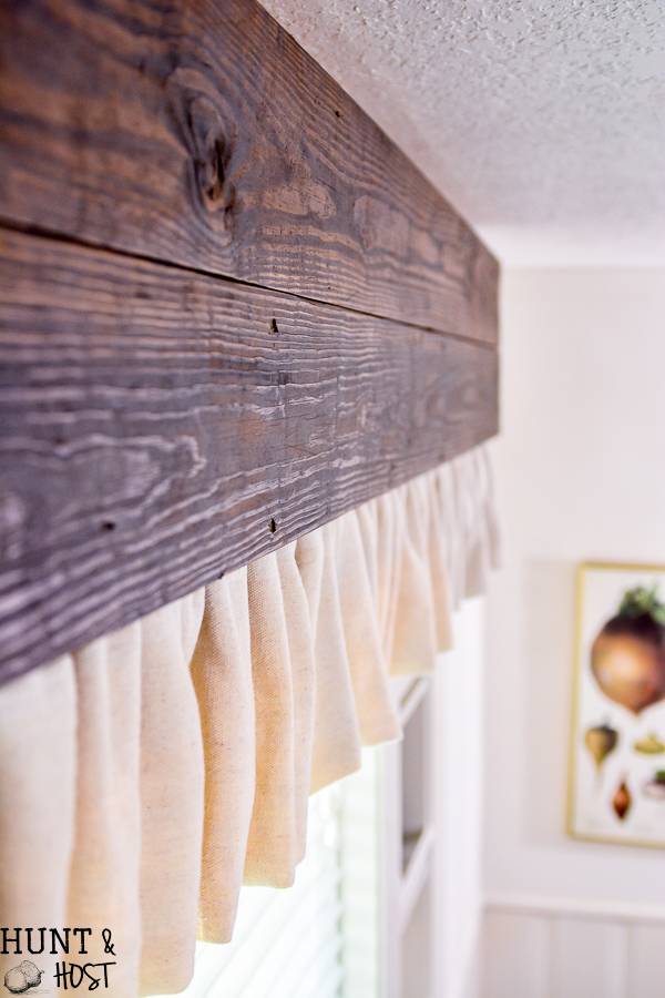 Make inexpensive custom curtains from old wood and dropcloth. Dropcloth curtains are soft and casual, rich wood is the finishing touch. Easy DIY curtain tutorial. 