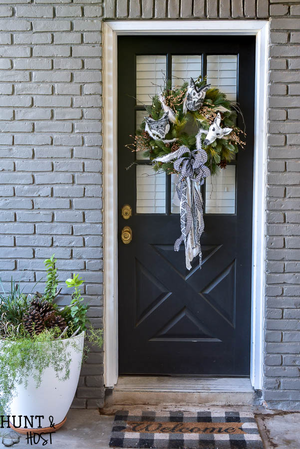 Christmas wreath ideas for your front porch. Get in the Christmas spirit with this fun porch tour full of Christmas decorating ideas!