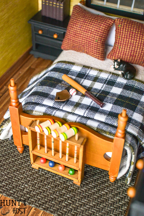 How precious is this rustic boys bedroom? These dollhouse bedroom ideas are perfect for the outdoor loving little boy, deer mount and all!