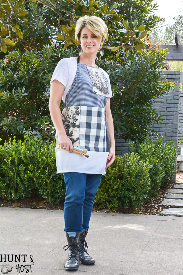 The perfect craft apron from fabric scraps, old clothes and linen closet toss outs. An easy pattern idea for how to make an apron from a shirt. This apron even has a cell phone pocket and hammer loop. 