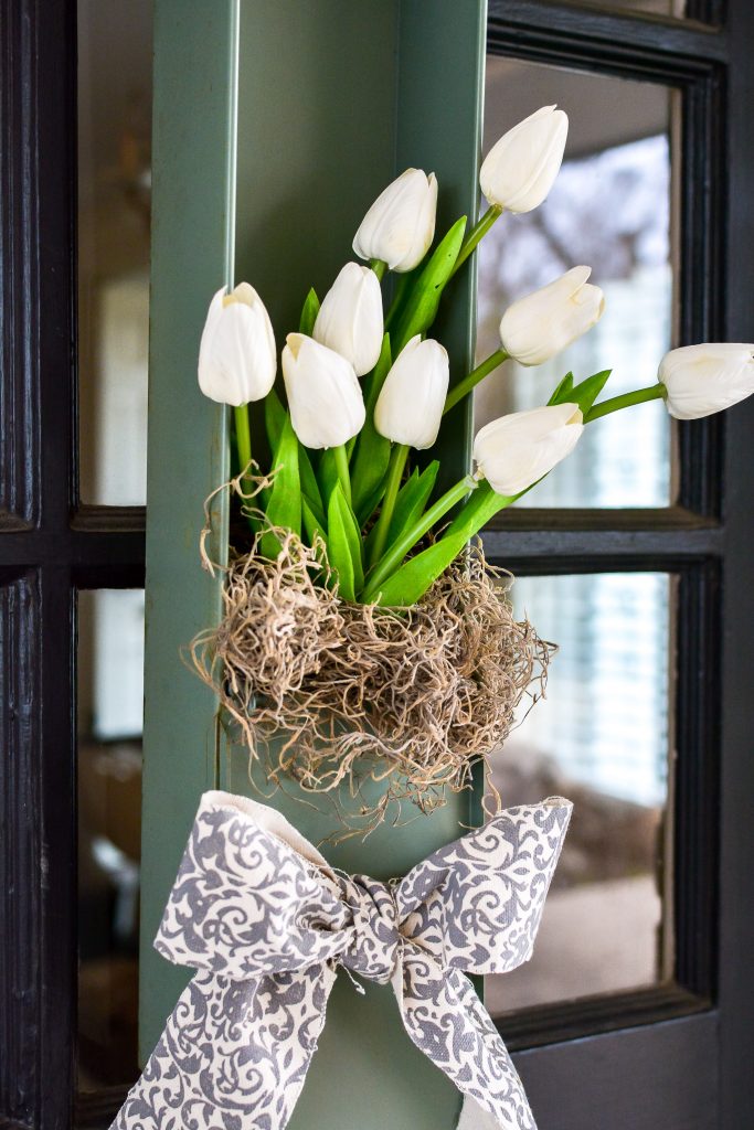 This white tulip wreath for the front door would look great as wall art too. Perfect for your spring decor this upcycled vintage safety deposit box was a unique Round Top Antiques Week find. 