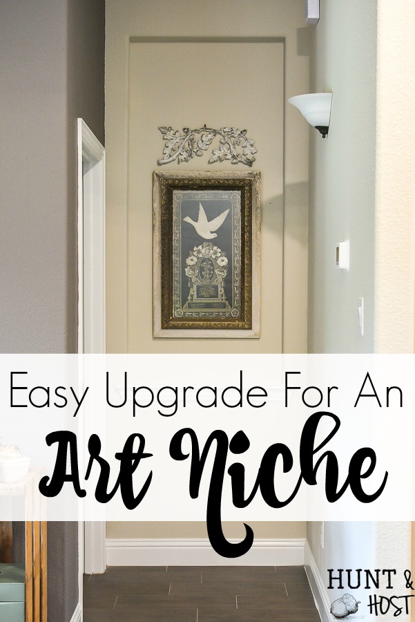 Taking your boring art niche up a notch with this quick afternoon makeover. How to install peel and stick wood tiles to decorate a small space with rustic style. #woodtile #artniche #rusticdecor #woodwall #easyshiplap