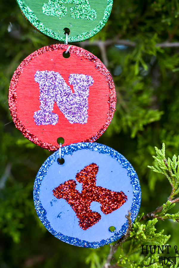 Make your own personalized Christmas ornament with your name, your kid's name or just fun Christmas sayings and words. This easy DIY takes no special tools or machines. You can make custom christmas ornaments to fit your color scheme and any name, even a christmas ornament for unusual names! Everyone loves to see their name in glitter and on the Christmas tree so make these special ornaments for the whole family. #handmadechristmas #christmastreeornaments #decoratethetree #nameinlights #DIYChristmasornament #glitterornament #easyDIYCHristmas