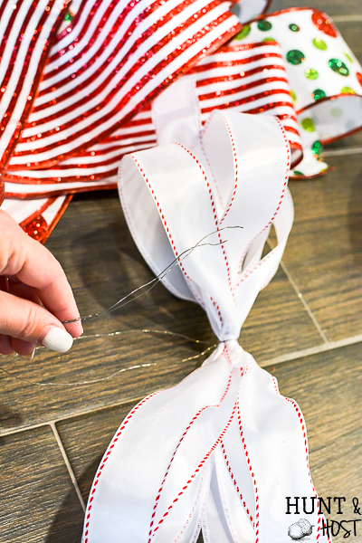 Learn how to make a beautiful and easy Christmas bow tree topper to update your Christmas decoration. This home tour highlights classic heirloom Christmas ornaments and decorating given a fresh update with new ribbons and garland. #handmadewithJOANN #Christmasupdate #bowmaking