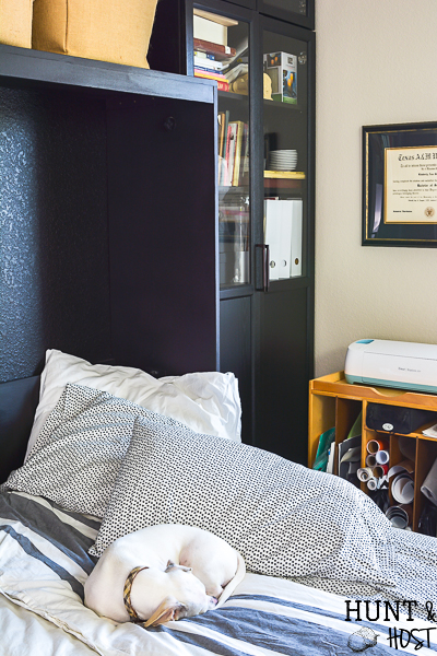 We added a Murphy bed to the craft room/guest bedroom and it is a space saver for sure. See how we paired the IKEA Billy bookcase with a custom Murphy bed for an office/craft/spare room with tons of functional storage and style. #IKEA #craftroom #murphybedidea #WhereWomenCreate #craftroomidea