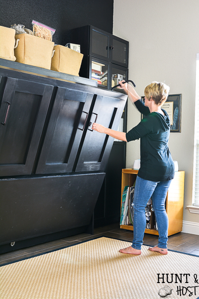We added a Murphy bed to the craft room/guest bedroom and it is a space saver for sure. See how we paired the IKEA Billy bookcase with a custom Murphy bed for an office/craft/spare room with tons of functional storage and style. #IKEA #craftroom #murphybedidea #WhereWomenCreate #craftroomidea