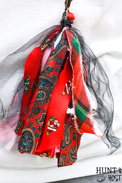 How to make old neckties into precious jewelry. This no sew necktie craft will recycle those out of style thrift store neckties into a cute tassel necklace on a serious budget. #diyjewelry #upcycleidea #vintagestyle #necktieaccessory #fashiononabudget
